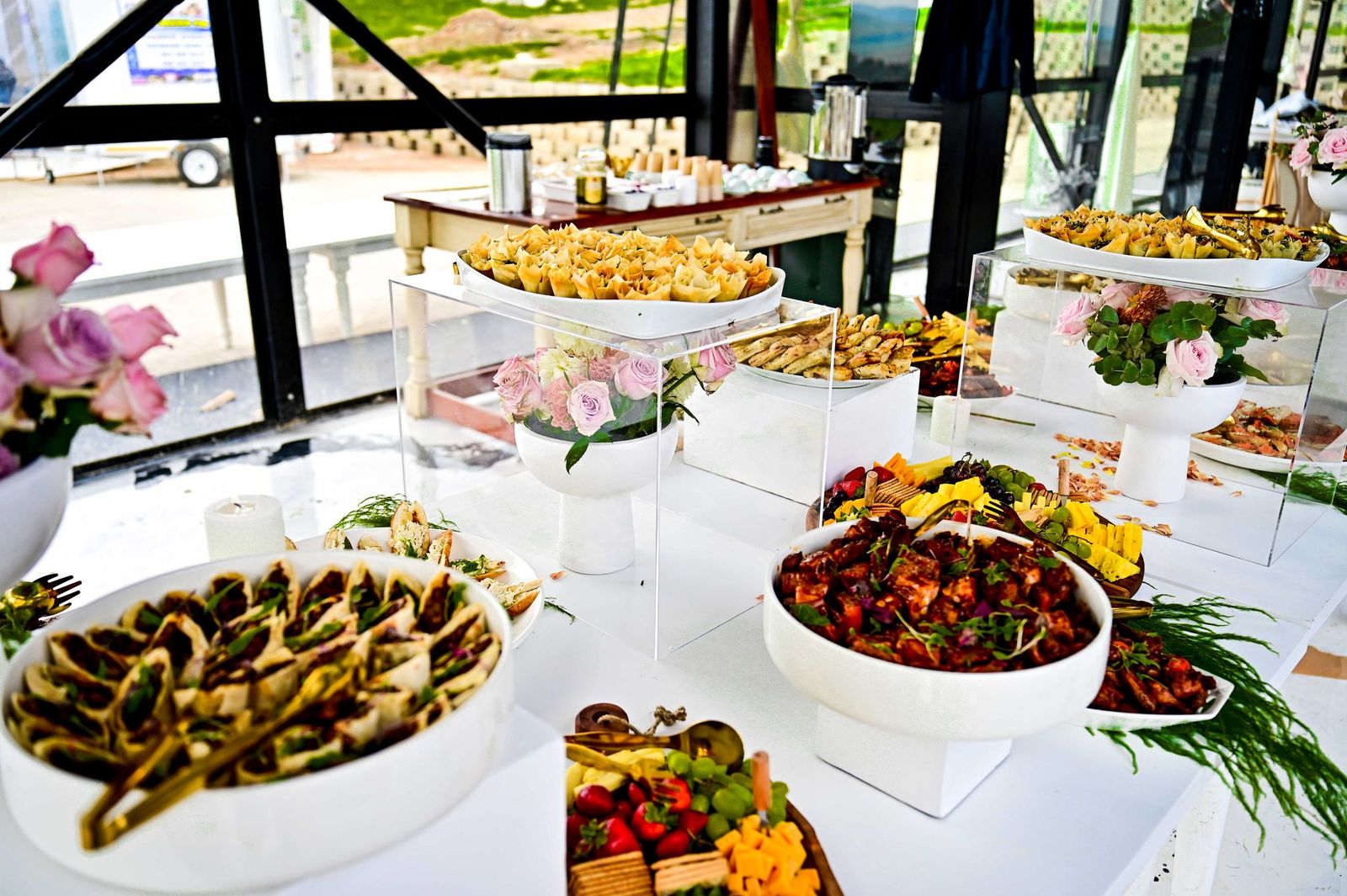 Vibrant harvest table spread with fresh ingredients and artisan platters